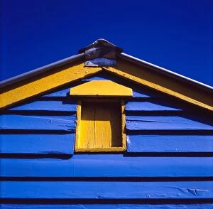 Brighton Beach Melbourne Collection: Blue and yellow painted building under blue sky