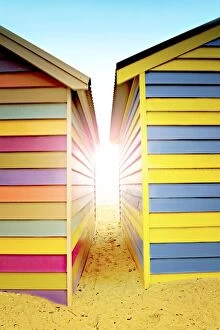 Port Phillip Bay Collection: Bright sunlight between beach huts