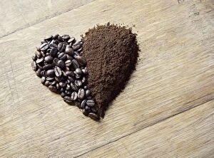 Related Images Photographic Print Collection: Coffee beans and grounds forming a heart shape