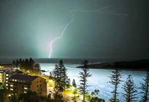 Non Urban Scene Collection: A lightning strike hits the surface of the water in the distance