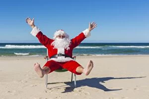 Father Christmas Greetings Card Collection: Santa Claus at the Beach