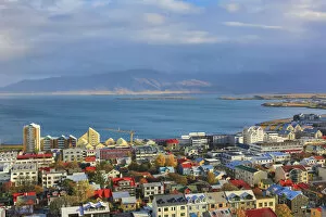Urban landscapes Photographic Print Collection: Aerial view over downtown Reykjavik with ocean and mountain at back, Iceland