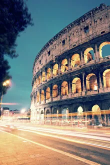Flavio Collection: Colosseum at night with light trails from cars