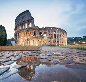 Flavio Collection: Colosseum reflected at sunrise, Rome, Italy
