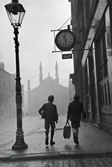 Fine art Collection: Gorbals area of Glasgow; Two young boys walking along a street in 1948