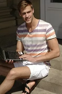 Personal Collection: Young man with laptop sitting on steps