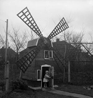 Littlehampton Fine Art Print Collection: Five-year-old Denise Holmes and her sister Nicola, two, now have a windmill at