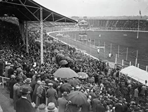 Monochrome photography Collection: Greyhound race meeting at the White City. A portion of the crowd watching the parade