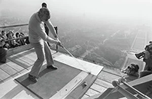Tour De France Metal Print Collection: American Golfer Arnold Palmer kicks off from the second floor of the Eiffel Tower