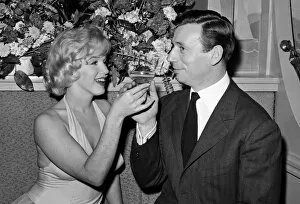 Actress Collection: Marilyn Monroe and her co-star, French actor and singer Yves Montand