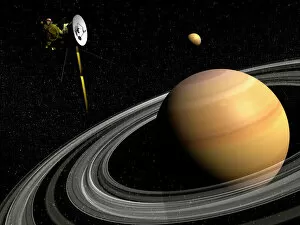 Technology Collection: Cassini spacecraft orbiting Saturn and and its moon Titan