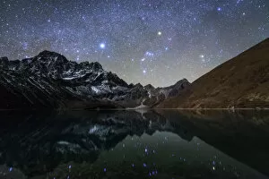 Wilderness Collection: Celestial sky with Sirius, Orion and Aldebaran shining bove Pharilapche Peak in Nepal