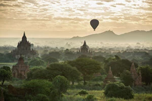 Bagan Collection: Hot air balloon over the Temples of Bagan at dawn, Myanmar, November 2012