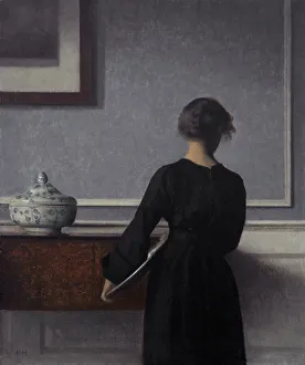 Vilhelm Hammershoi Print: Interior with Young Woman from Behind
