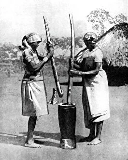Africa Collection: Two Mashona tribeswomen pounding maize and millet, Zimbabwe, Africa, 1936. Artist: Wide World Photos
