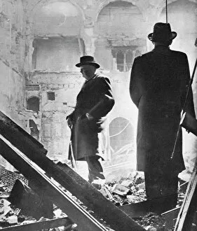 Black and white portraits Collection: Mr. Churchill contemplates the ruins of the House of Commons, bombed in May 1941, 1941