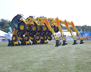 Forest artwork Fine Art Print Collection: Stunt JCB diggers perfoming formation dance routine at New Forest show 2006