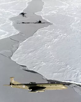 RAF Cushion Collection: An RAF Nimrod MR2 on patrol in the skies over the ice, it is shown with two submarines