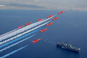 Rafat Collection: Red Arrows flying over HMS Illustrious