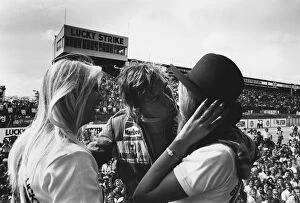 Related Images Framed Print Collection: 1976 South African Grand Prix: James Hunt, 2nd position, celebrates on the podium with some girls