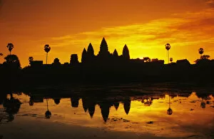 Angkor Jigsaw Puzzle Collection: Cambodia, Siem Reap, Silhouette of temple against orange sky during sunrise; Angkor wat