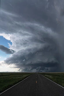 Country Roads Collection: Road leading directly in to a supercell thunderstorm
