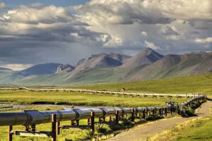 Haul Road Collection: Semi Truck Driving The Haul Road (James Dalton Highway) Along The Trans Alaska Oil Pipeline On The