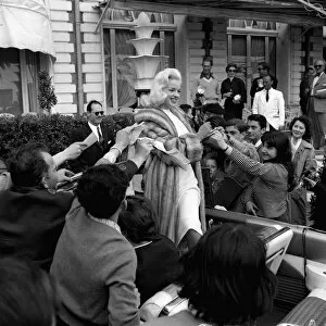 Festivals Collection: Actress Diana Dors surrounded by autograph hunters at Cannes Film Festival