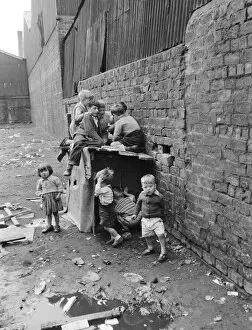 Boys Collection: Children playing in the back alleys of a Goven tenement block. September 1956