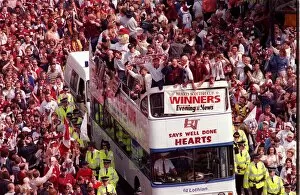 00347 Collection: Heart of Midlothian footballers are cheered by fans as they celebrate with the Scottish