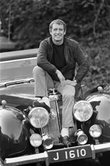 Film Metal Print Collection: John Nettles, actor, pictured on the set of Bergerac. He is sitting on the car his