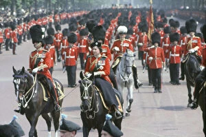 Royals Collection: Her Majesty Queen Elizabeth II rides on horseback through The Mall in Central London