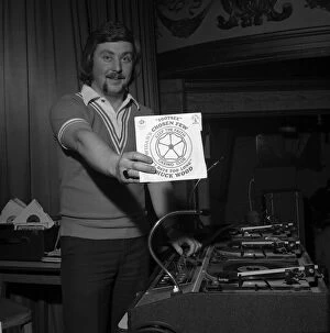 Dance Collection: Wigan Casino dancers 1975 Northern Soul DJ Russ Winstanley holds up a 45 single
