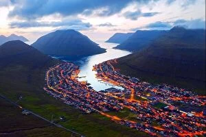 Aerial Views Canvas Print Collection: Fantastic aerial evening cityscape of Klaksvik town with glowing streets and fjord, Bordoy island